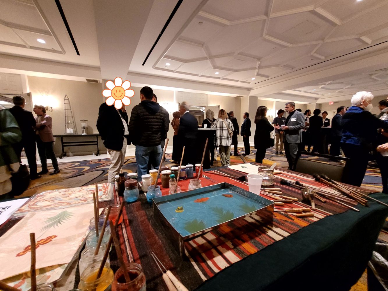 Erdem Balikci demonstrating ebru art at a public event
